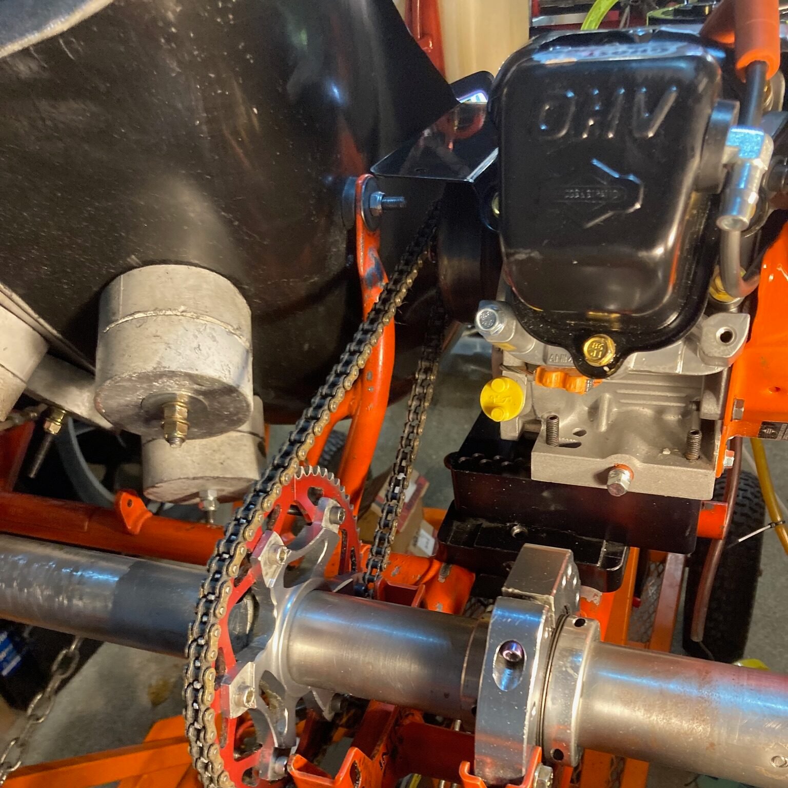 7 scuba weights attached to a go kart seat with bolts